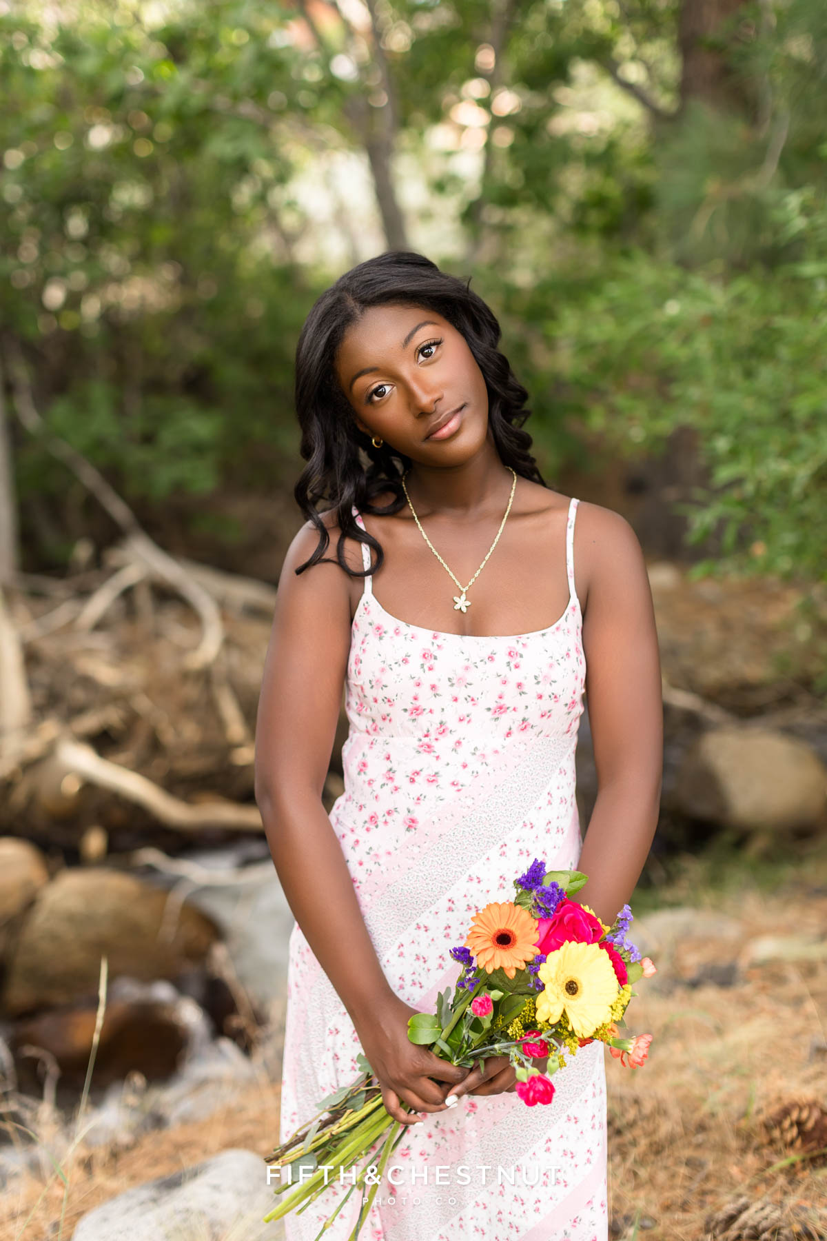 High school senior in pink sundress among summer blooms – flower farm senior photos in Reno/Tahoe