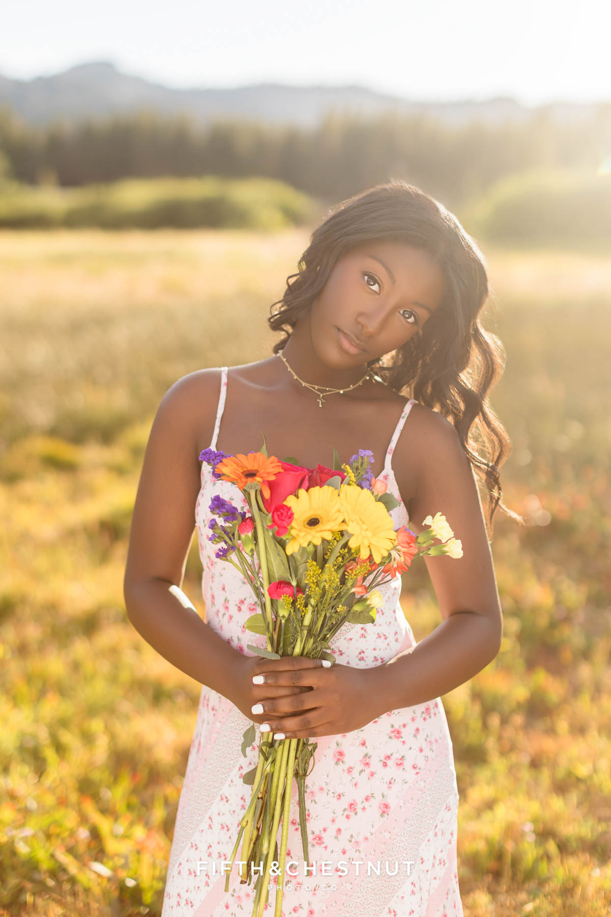High school senior in pink sundress among summer blooms – flower farm senior photos in Reno/Tahoe