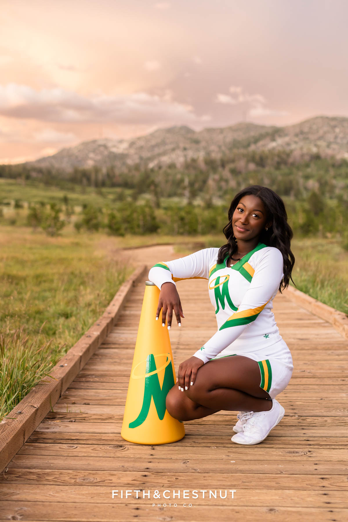 Cheerleader senior portraits with pom poms and megaphone – Reno Tahoe senior photos